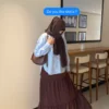 Side view of a brown three layer skirt for women with a flowy tiered silhouette.
