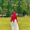 Back view of a white three layer skirt for women featuring a modest maxi design.
