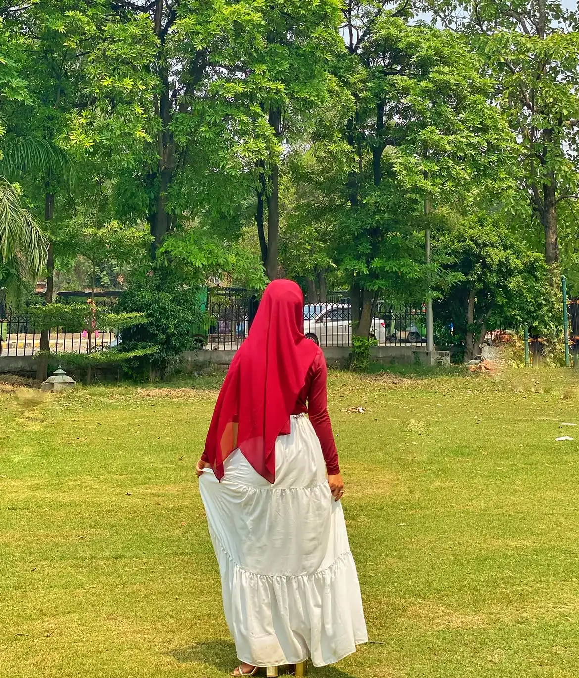 Back view of a white three layer skirt for women featuring a modest maxi design.