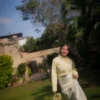 Lime yellow corset shirt for women with full sleeves and an adjustable waist tie.